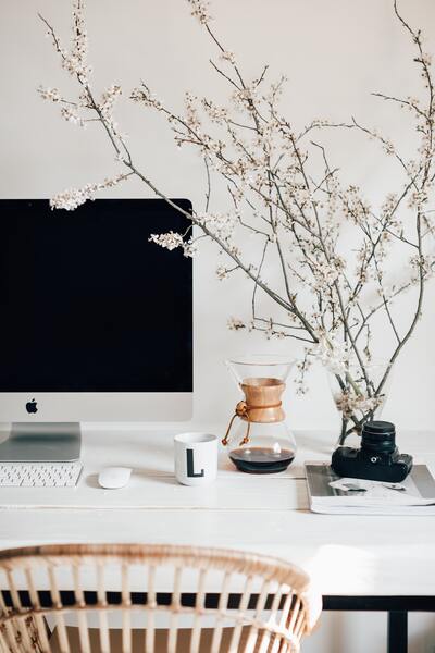 An iMac on a modern office desk.